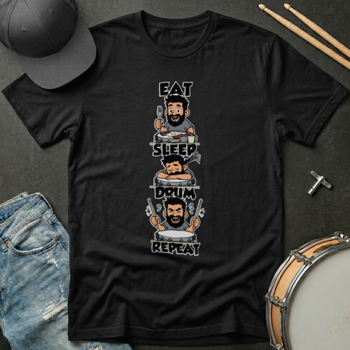 Black t-shirt with 'Eat Sleep Drum Repeat' graphic on a dark surface with drumsticks and a cap.