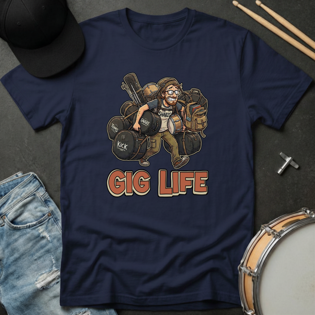 Navy blue t-shirt with 'Gig Life' graphic featuring a drummer, surrounded by drumsticks and a hat on a dark surface.