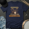 Navy blue t-shirt with drum set graphic and text 'Growing My Gear Collection' on a dark surface with accessories.