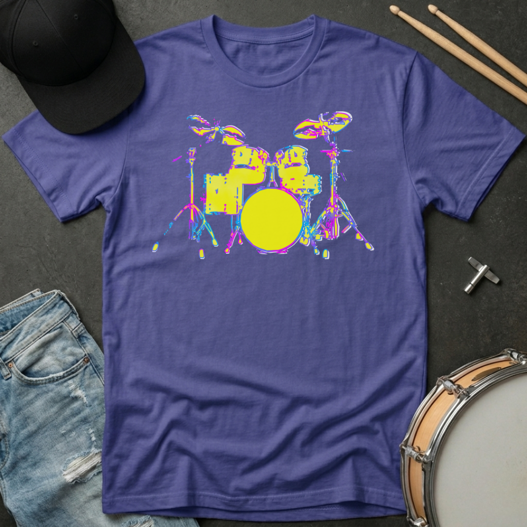 Purple t-shirt with colorful drum set graphic on a dark surface with denim jeans and drumsticks.
