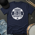 Navy blue t-shirt with 'Warning: Will talk about drums unprompted' graphic on a dark surface with drumsticks and a cap.